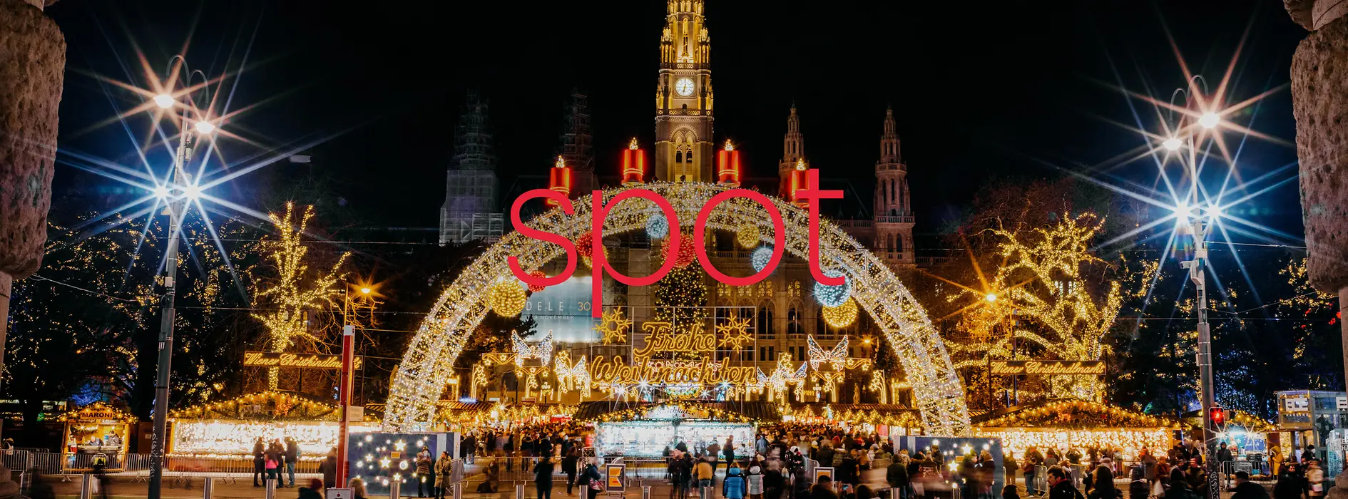 Christmas market at the town hall in the middle of the picture is written “Spot” in red letters
