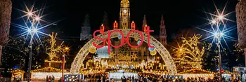 Christmas market at the town hall in the middle of the picture is written “Spot” in red letters