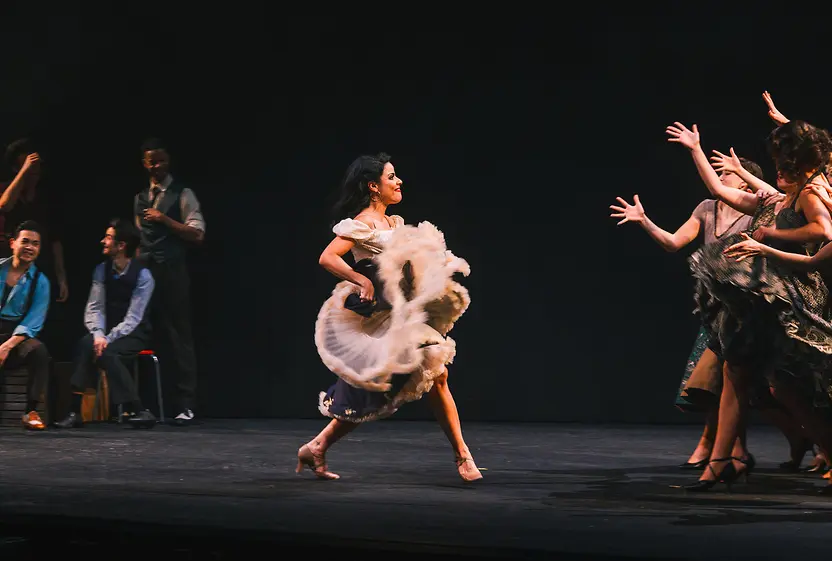 Dance scene from the musical "West Side Story" with actresses performing on stage